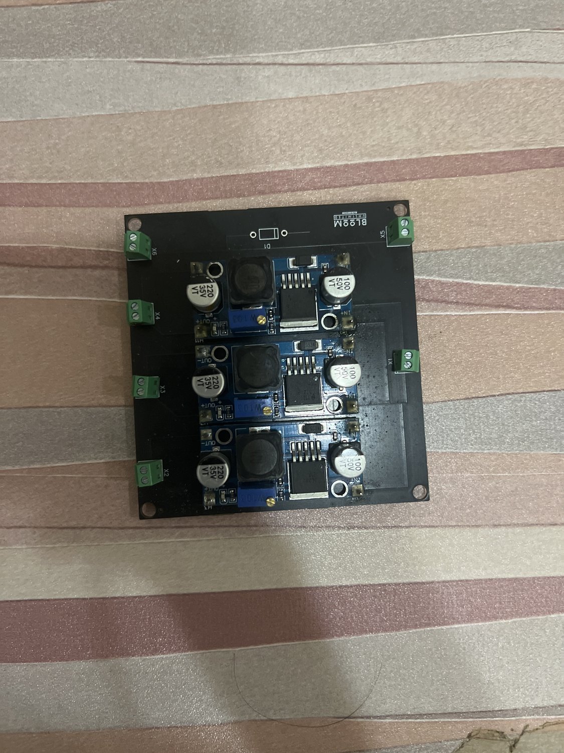 Assembled triple buck converter PCB with inductors and screw terminals